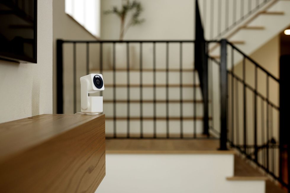 photo of Wyze Cam Pan v4 on a shelf inside a home.