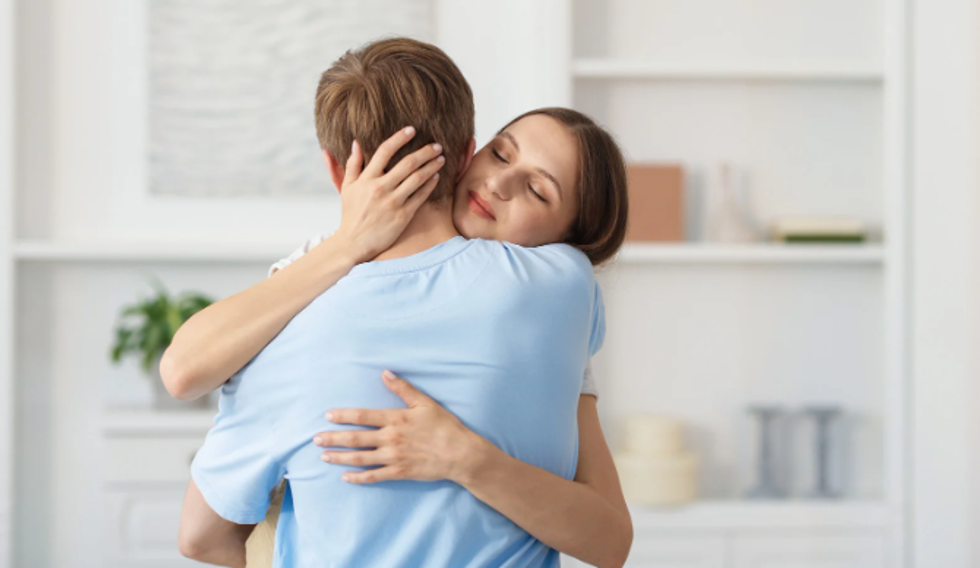 apology, sorry, argument, man and woman hugging, reconcile,