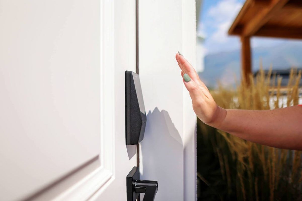 photo of a woman's hand over Wyze Palm Lock