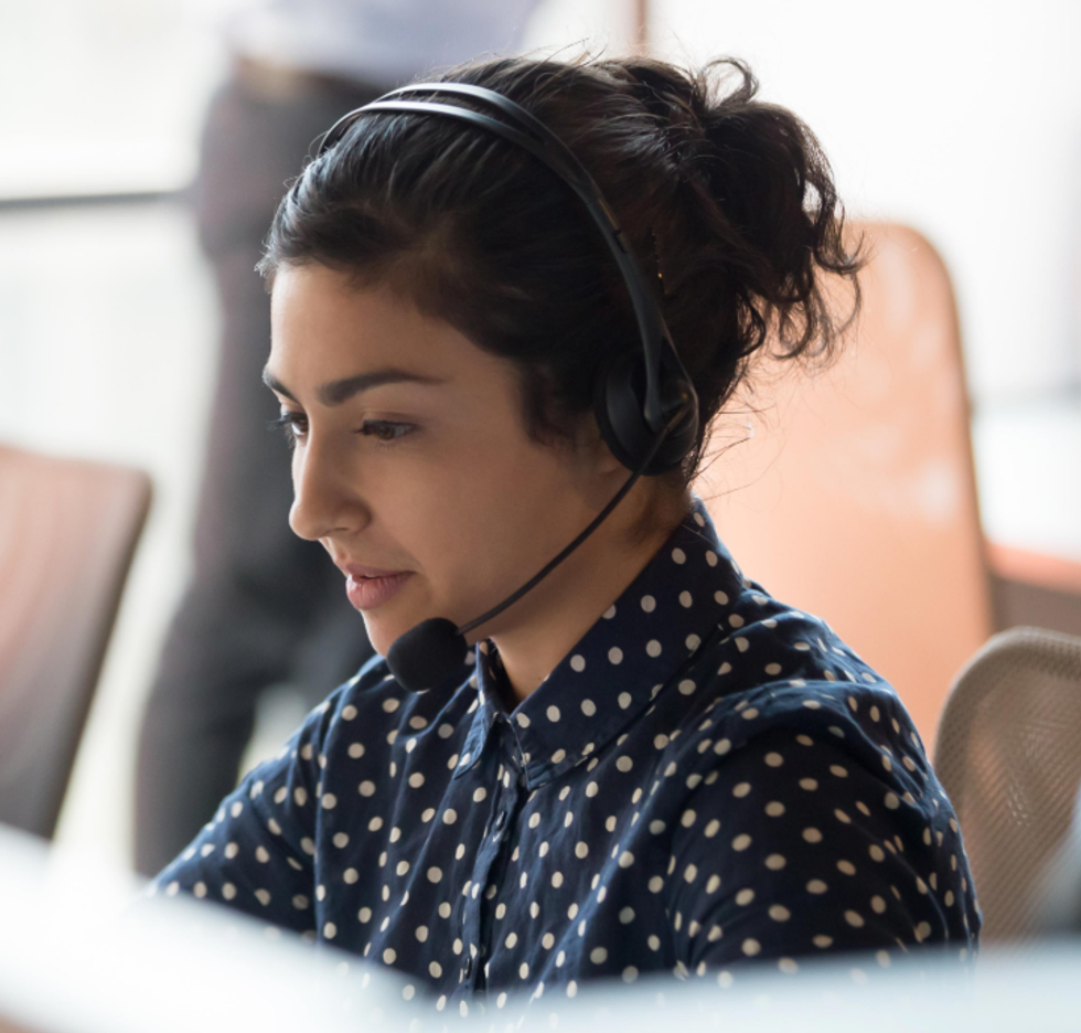 a photo of a Alexa Emergency Assist support person on the phone