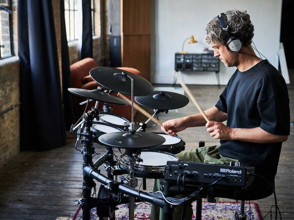 a man playing Roland V-Drums Series 5