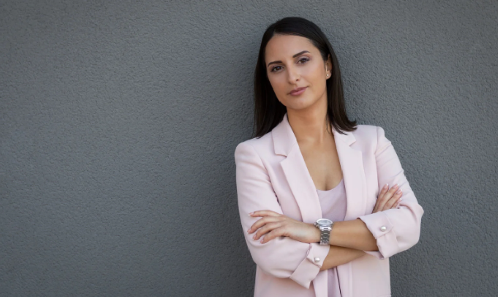 business woman, confident woman, standing straight, arms folded, intimidating