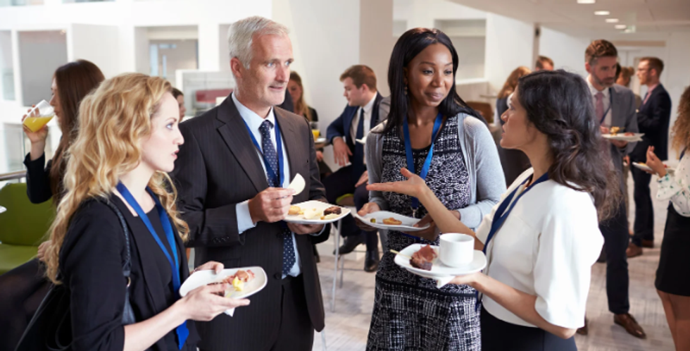 networking event, work event, employees talking, a woman talking, people in dress clothes