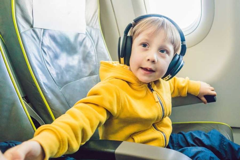 headphones, flight, courtesy, airplane etiquette, flying