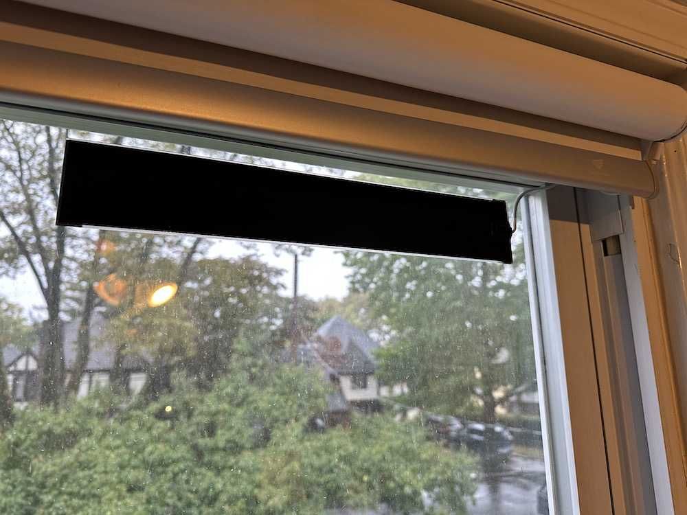 photo of SmartWings solar panel on a window