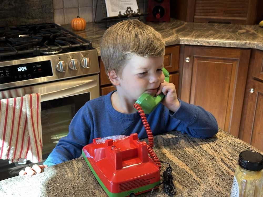 a child speaking with Santa on Santa's Magical Telephone