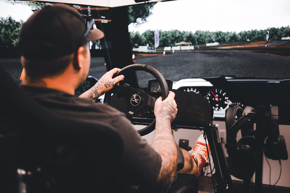 a man using a racing simulator rig