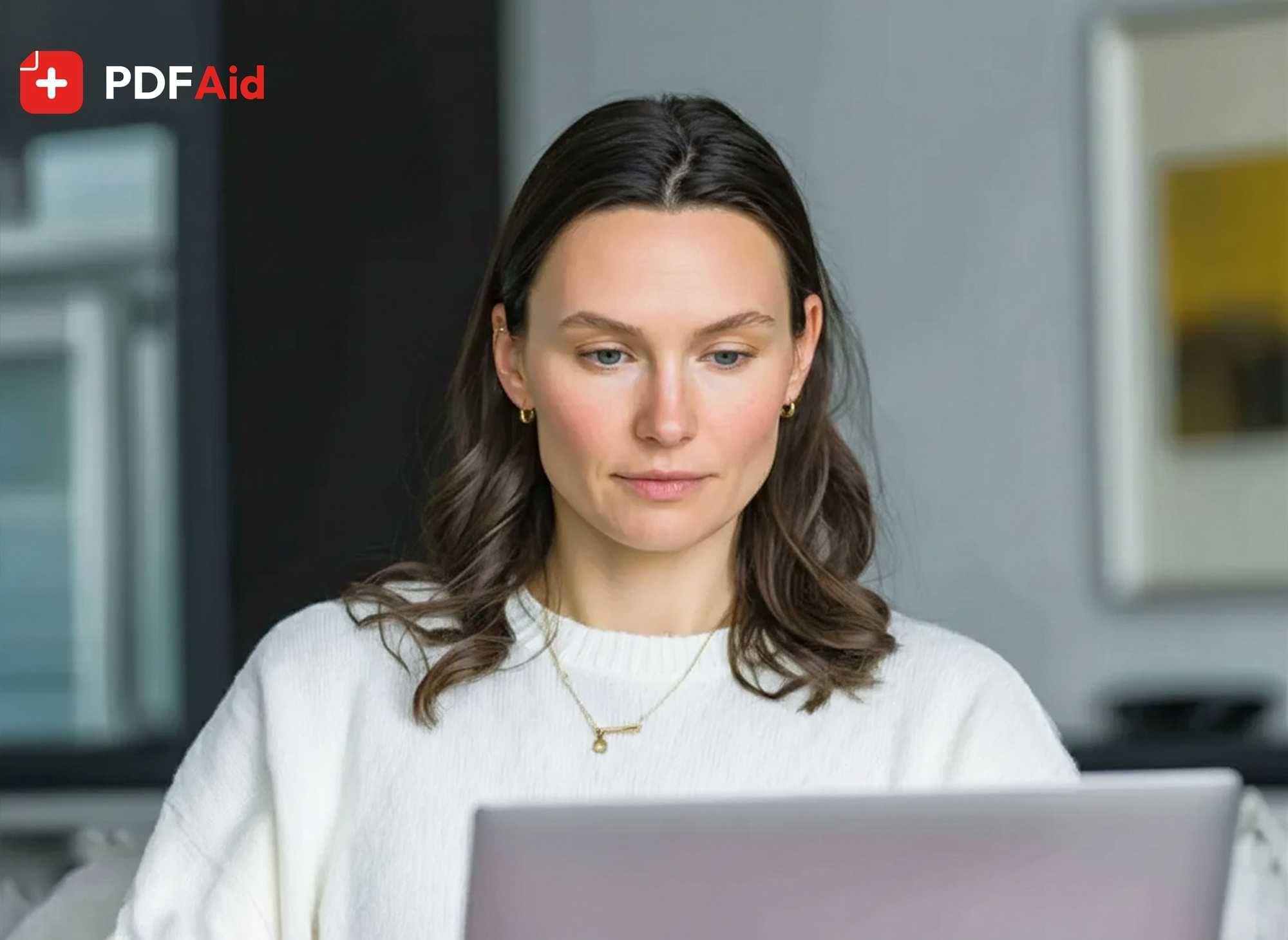 photo of a woman working on a laptop