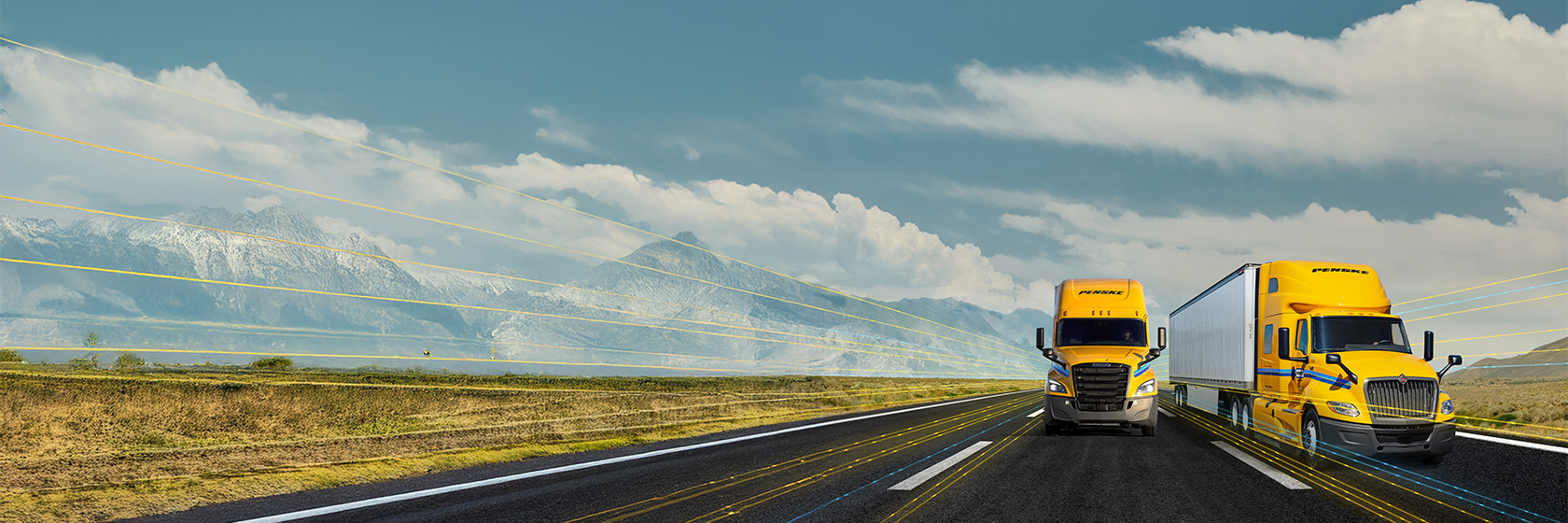 Penske tractor trailers driving in the desert