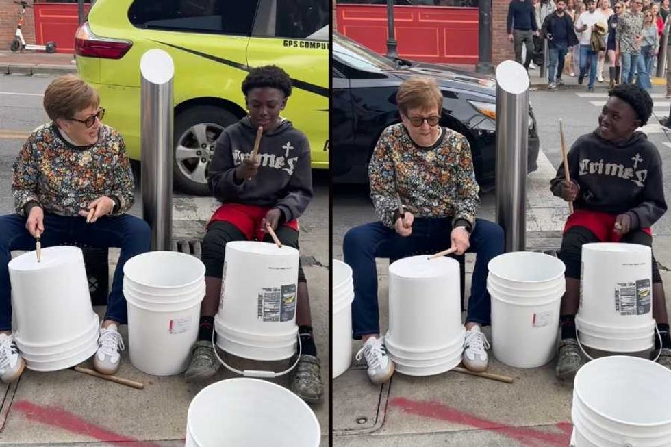 75-yr-old woman jams with a young street drummer in delightful viral moment