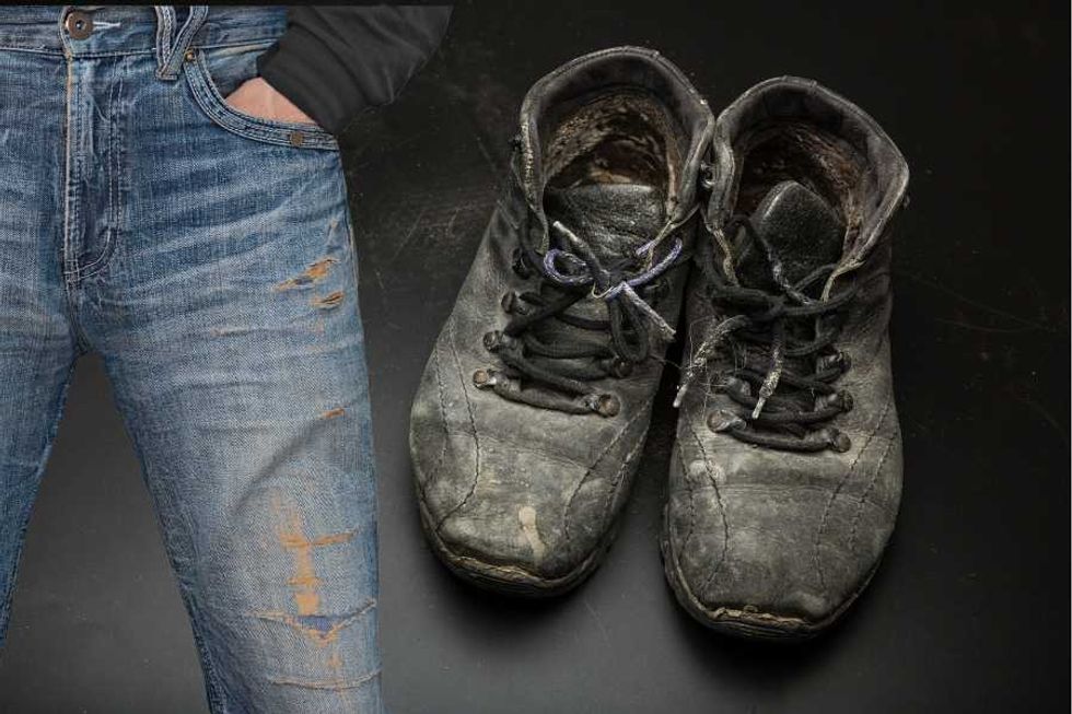 Boss noticed struggling employee was wearing tattered clothes. His response left the worker teary-eyed.