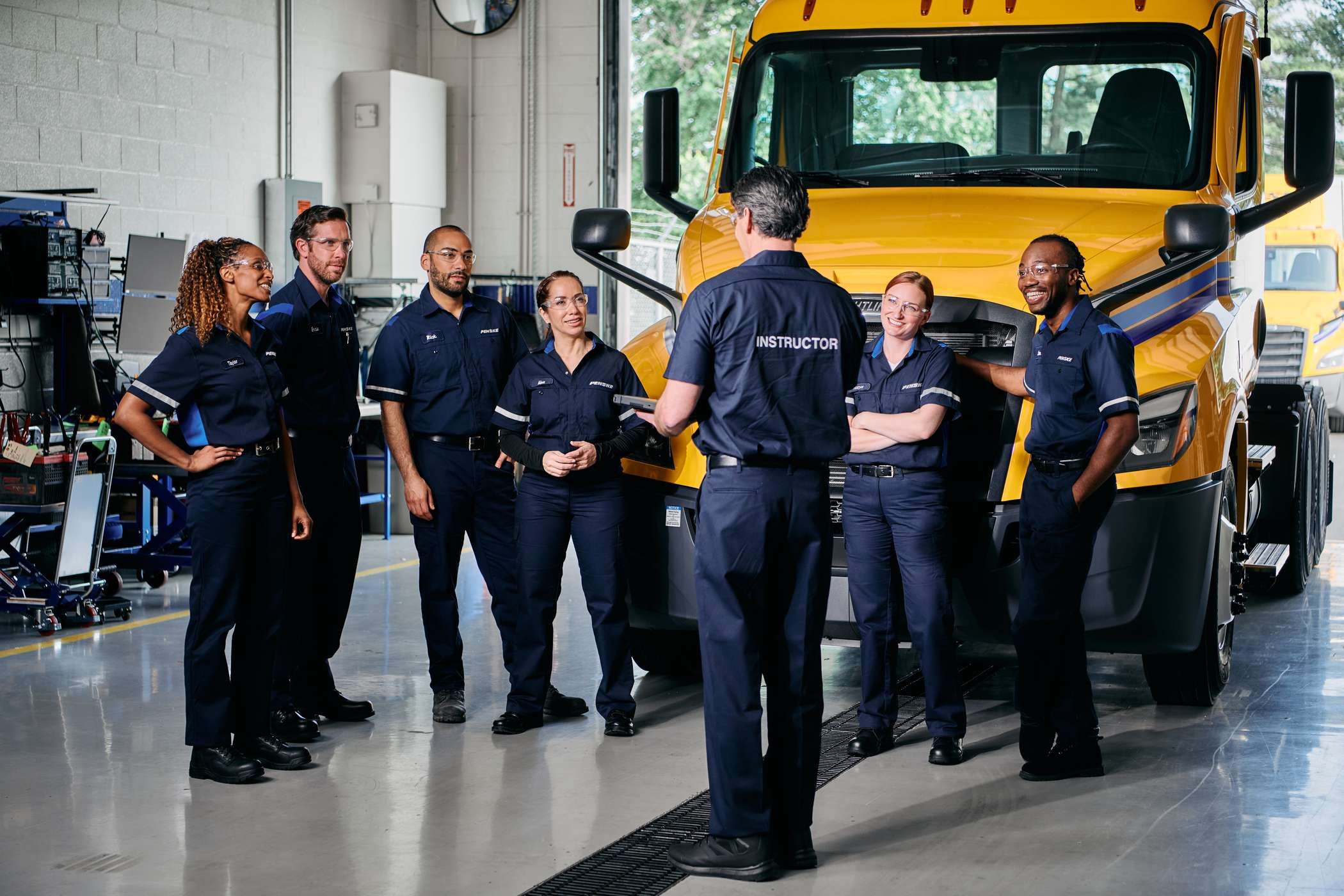 Team of truck technicians having a discussion