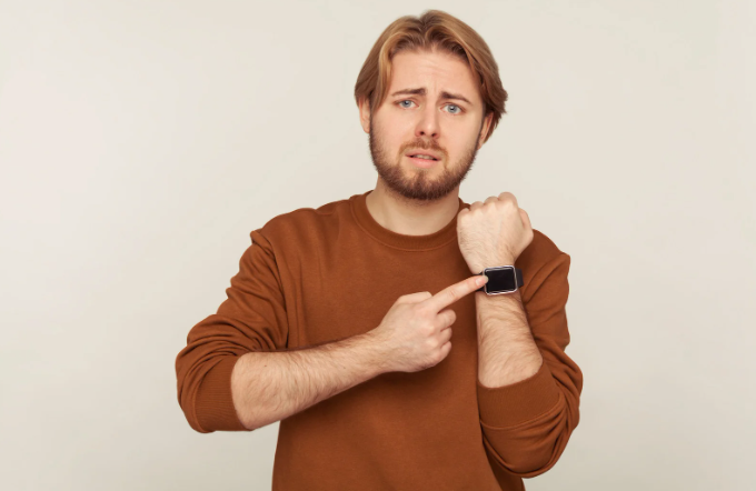 late, annoyed dad, man touching watch, time, courtesy, stressed man