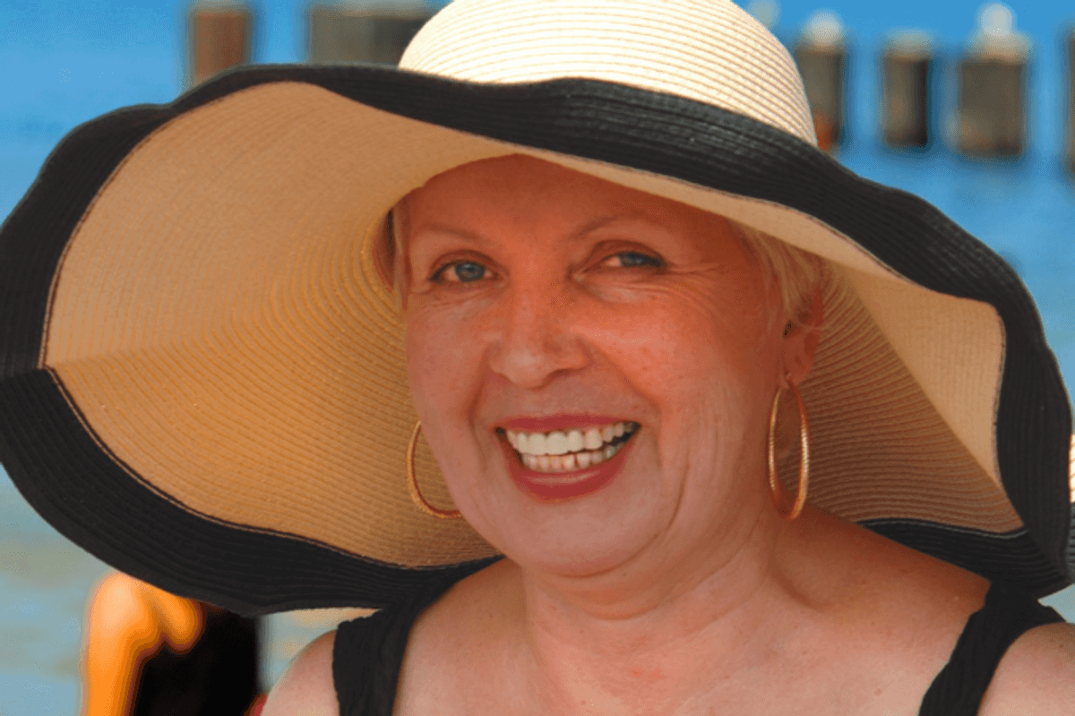 baby boomer, boomer grandma, boomer on vacation, sun hat, beach vacation