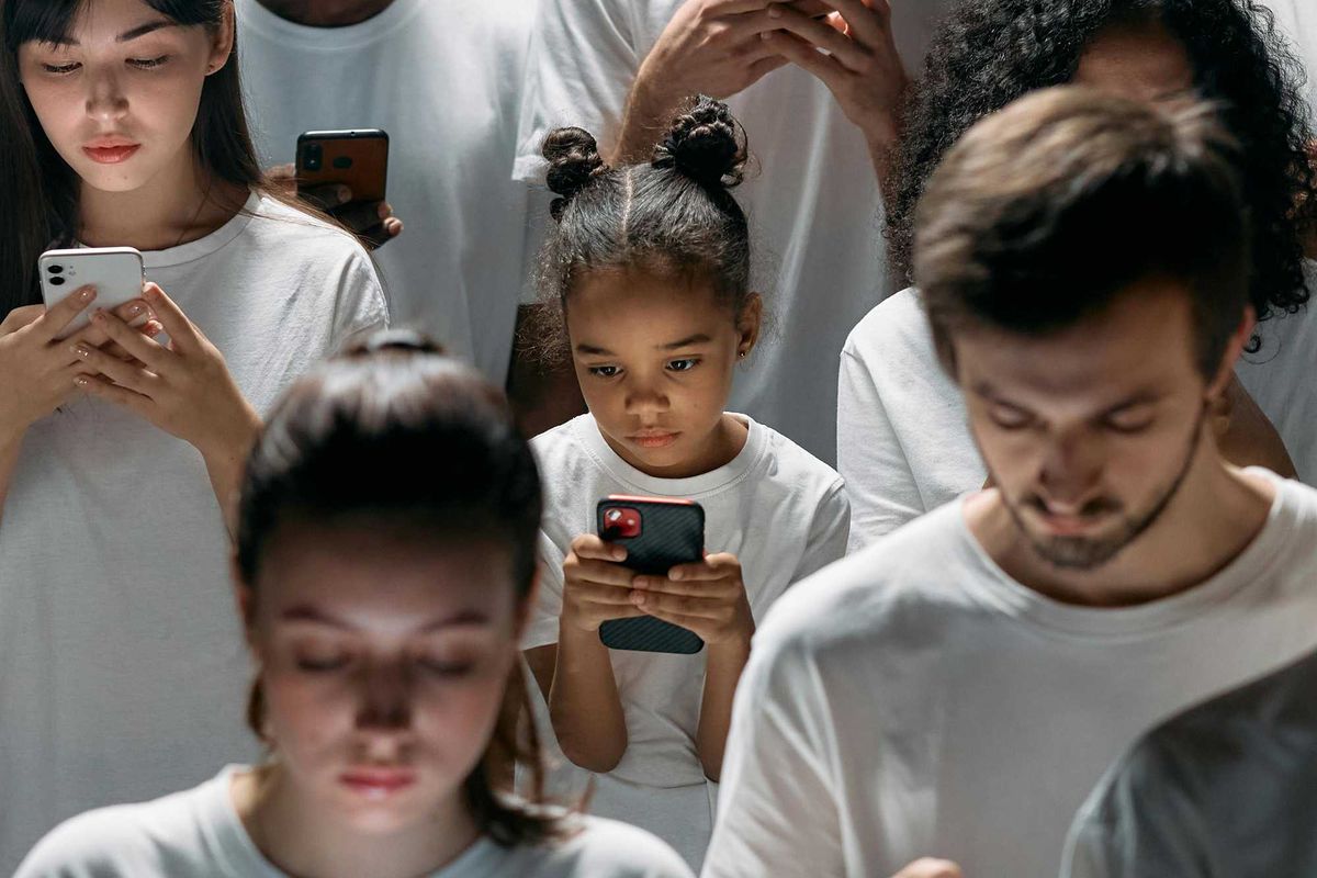 Photo of People Engaged on their Phones