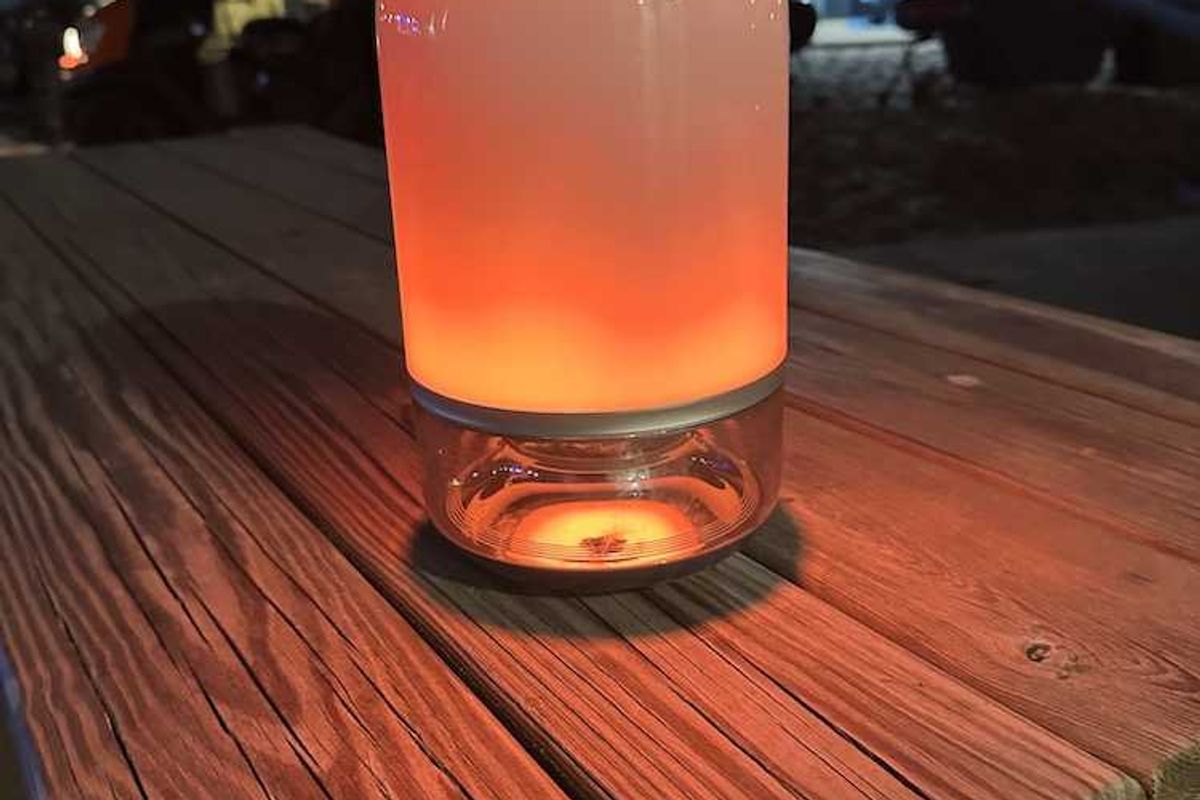 a photo of Govee Table Lamp 2 Pro on a picnic table at night at the beach.