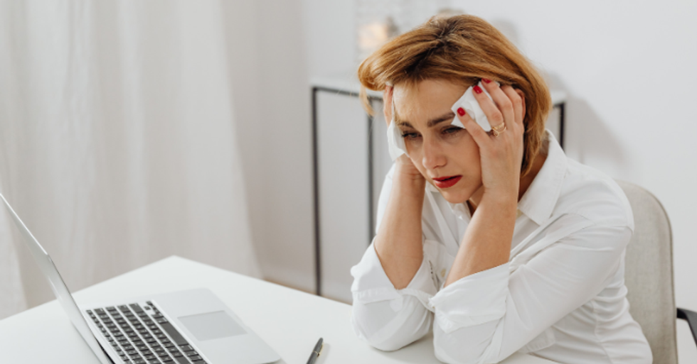 upset woman, woman at work, woman at computer, crying woman, millennial woman