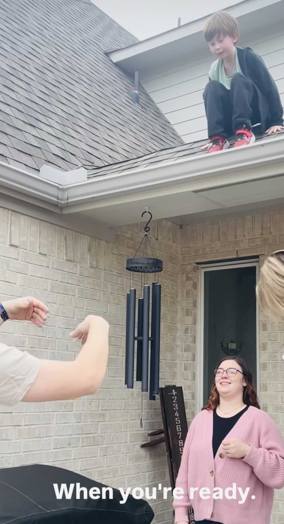 A boy got stuck on the roof. His dad's words gave him courage in this truly heartwarming clip.