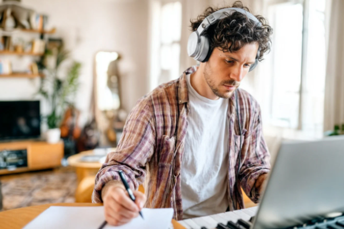 music, husband, man writing song, headphones, keyboard, piano