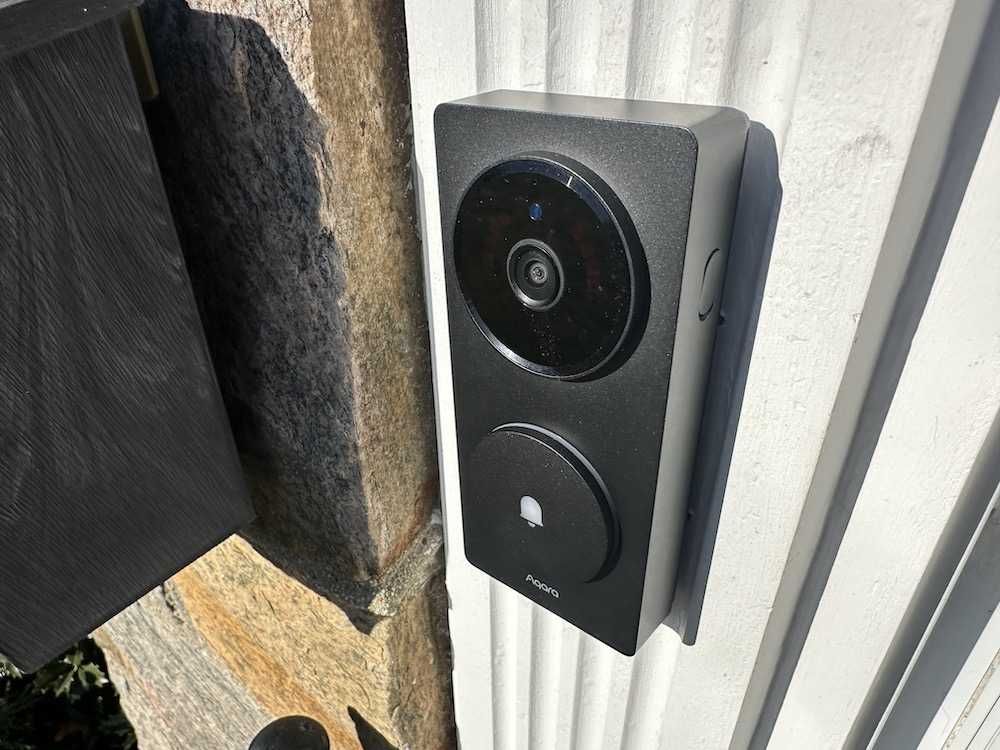 a photo of Aqara Doorbell Camera Hub G410 installed on a house in daytime