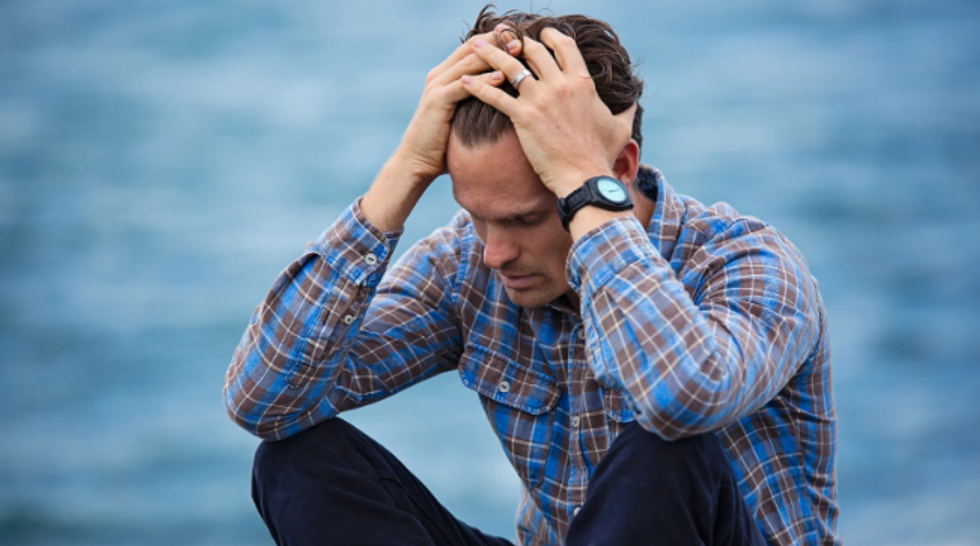 upset man, sad man, man in his 30s, man by ocean, anxiety, depression