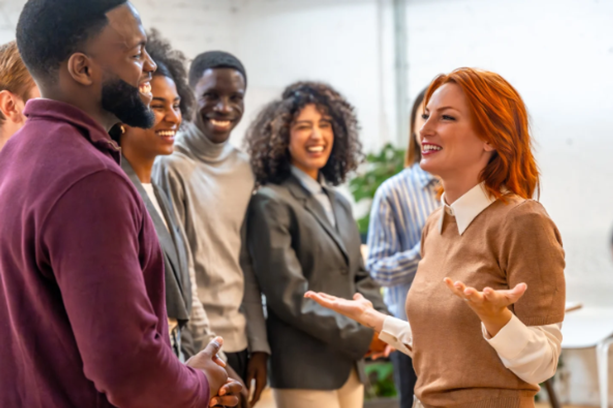 introduction, meeting people, coworkers, red-haired woman, man in sweatshirt
