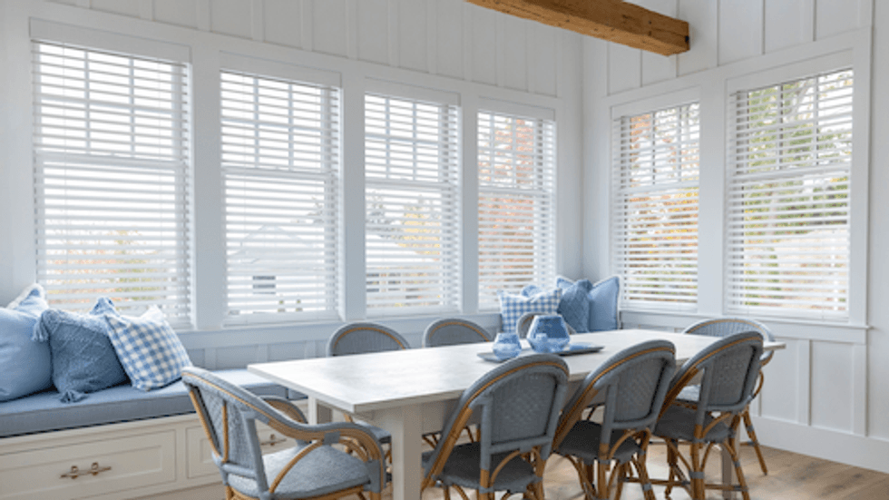 photo of Cas\u00e9ta Smart Wood Blinds installed in a dining room