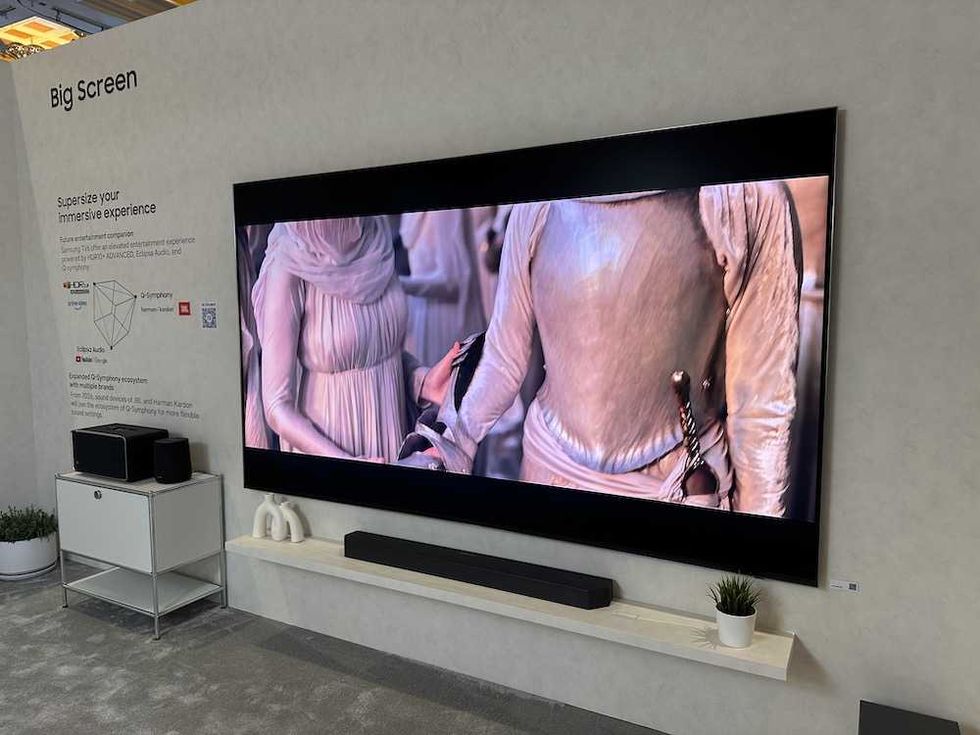 photo of samsung big screen tv on display at CES Show with surround sound