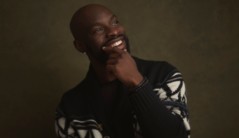 smailing man, ahppy man, good-looking man, man in sweater, man holding chin