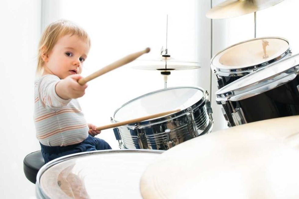 Precocious toddler drums and sings 'Pocketful of Sunshine' with stunning precision