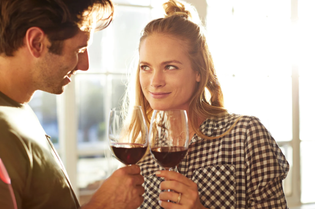 wine, couple, eye contact, blonde lady, smiling woman, starting into eyes