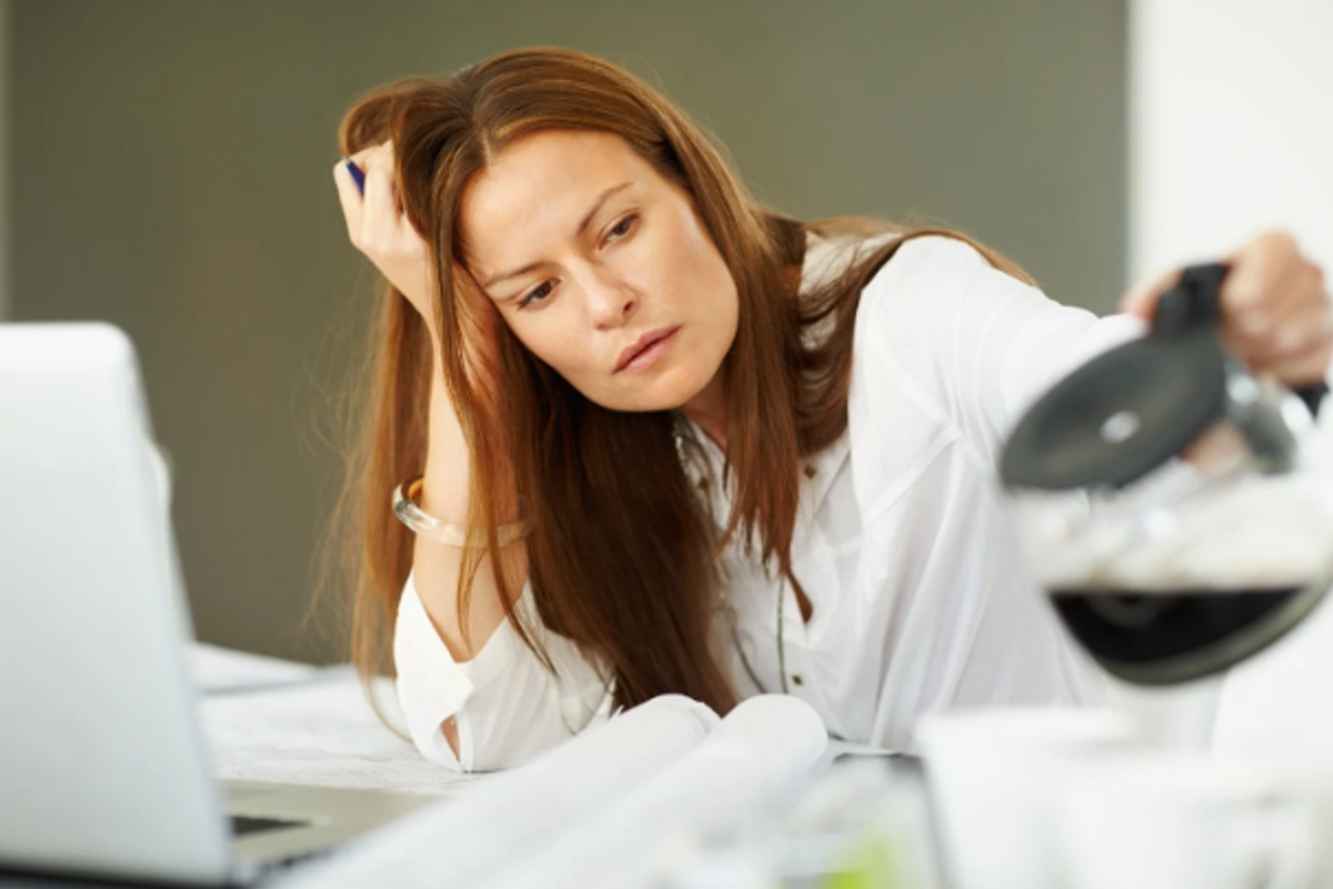 tired woman, coffee work, feeling off, redhead woman, woman at desk,
