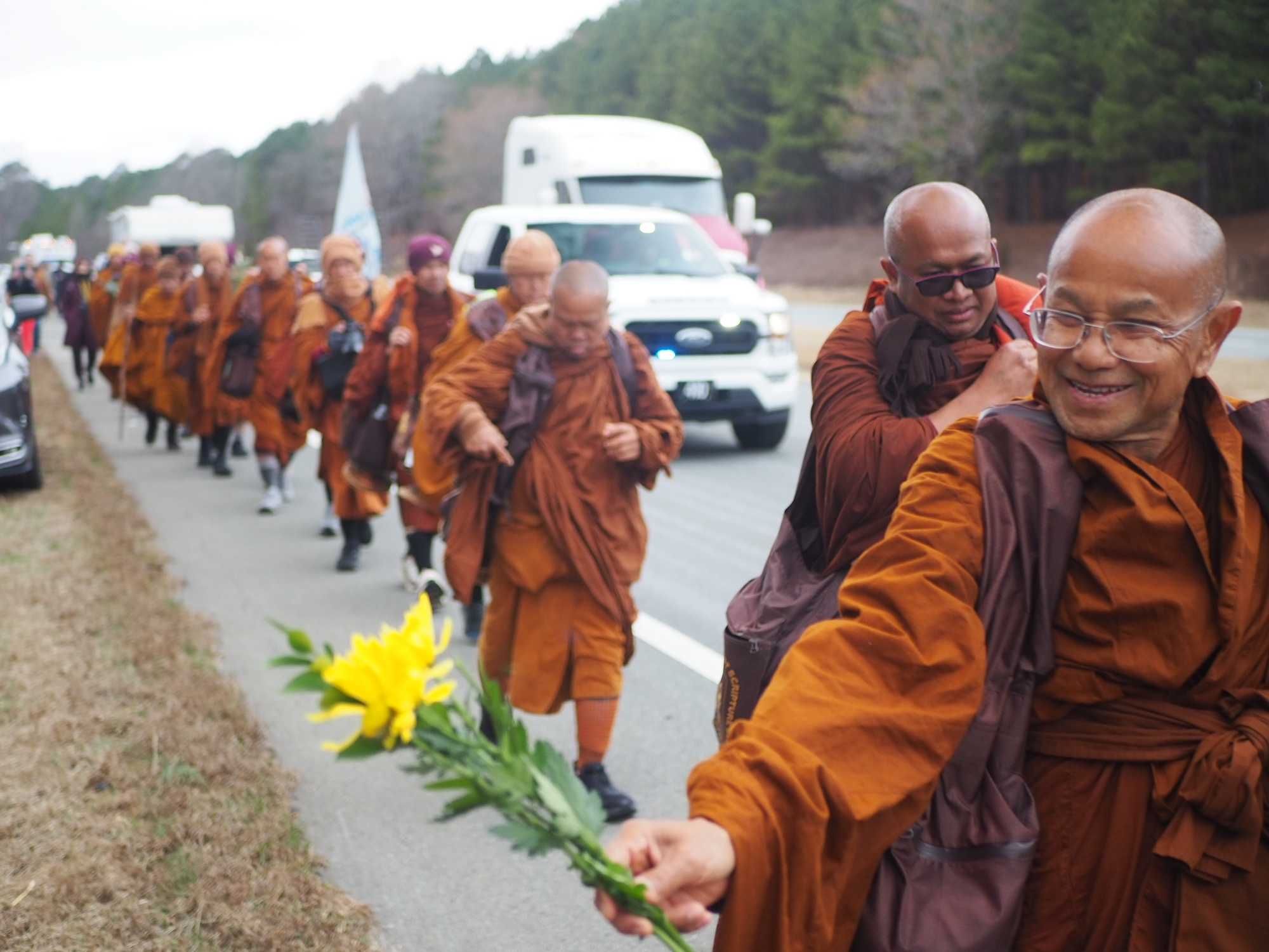 buddhist monks, raleigh north carolina, peace walk, flowers,