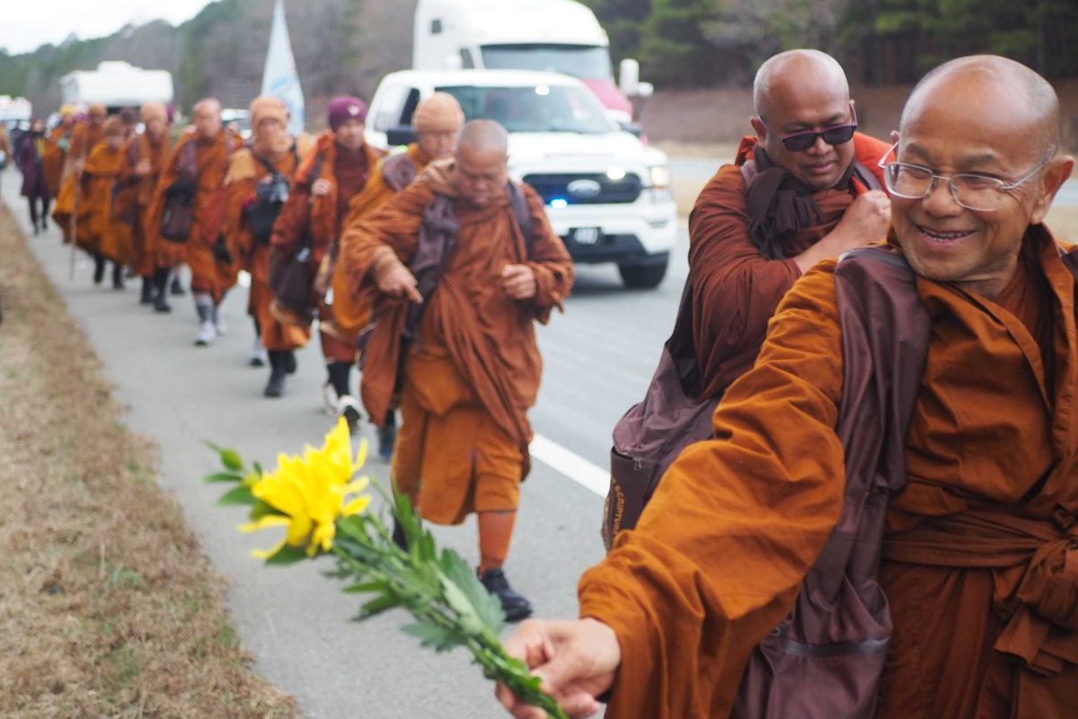 buddhist monks, raleigh north carolina, peace walk, flowers,