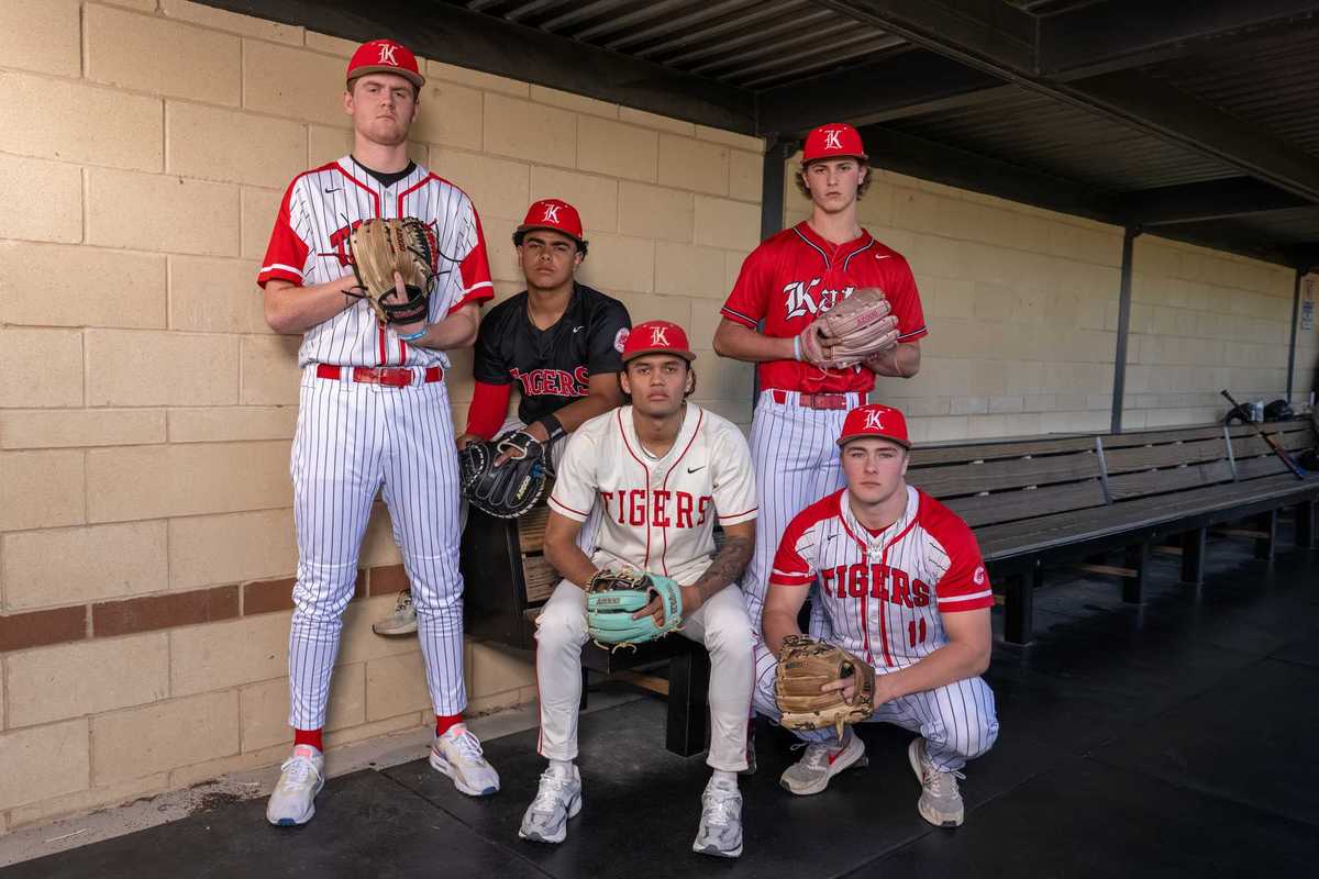 BATTLE RED: No. 12 Katy has balance at plate, on diamond