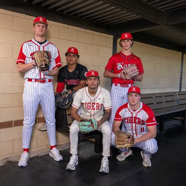 BATTLE RED: No. 12 Katy has balance at plate, on diamond