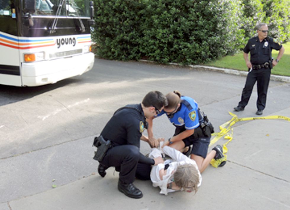 Three Arrested Blockading Bus at Genetically Engineered Tree Conference