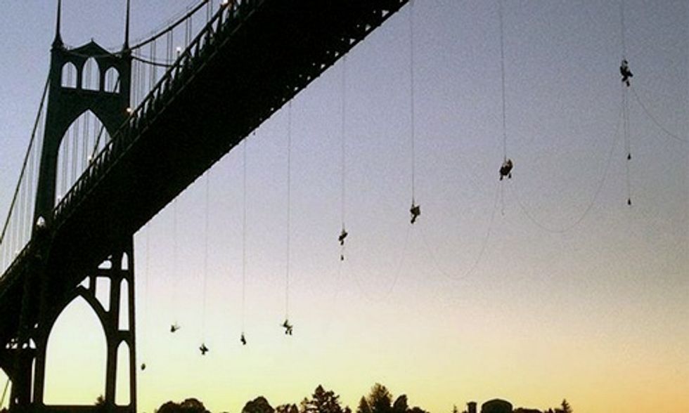 13 Climbers Suspended From Bridge Block Shell Oil Vessel From Heading to Arctic