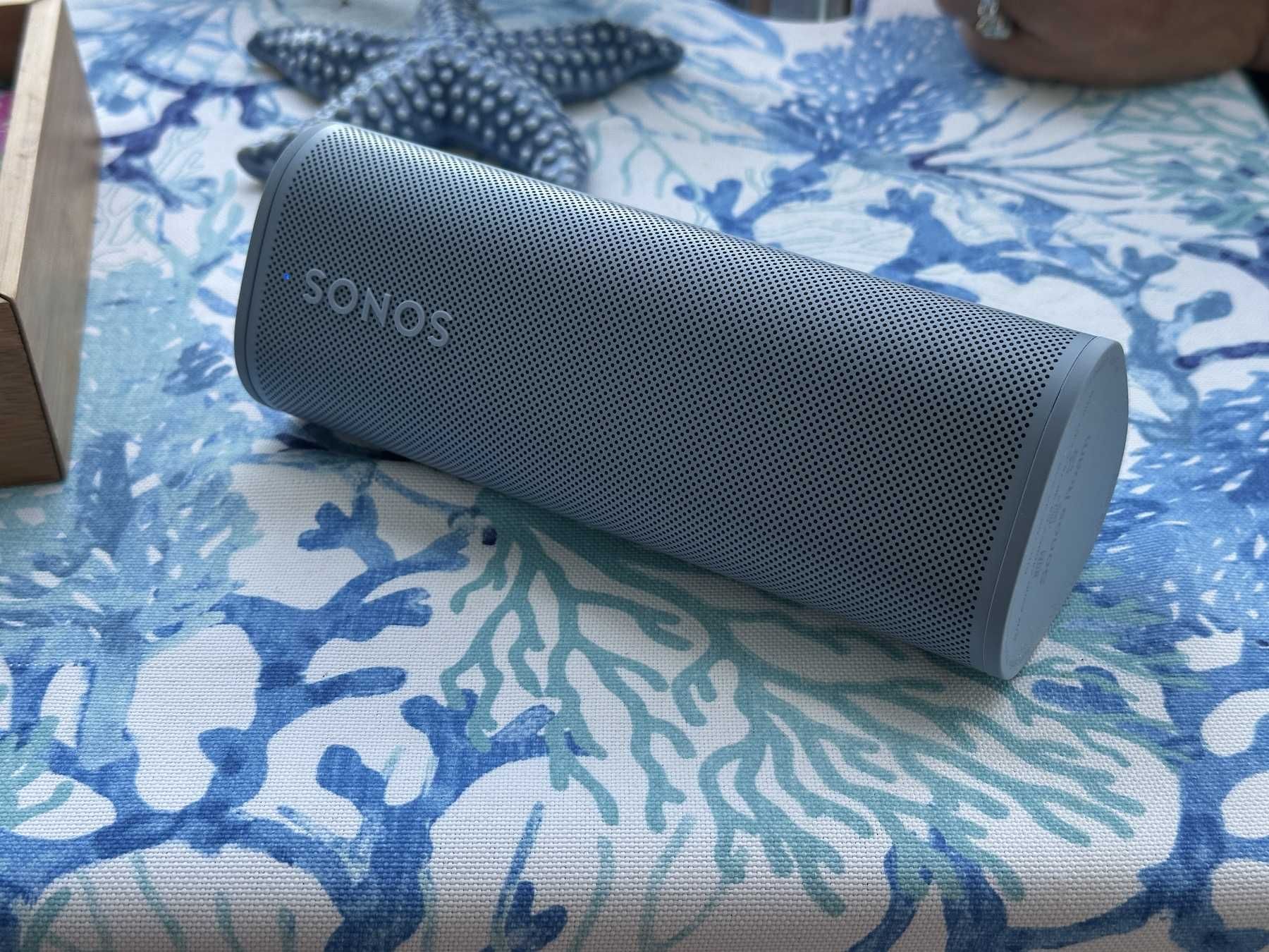 Sonos Roam 2 on a picnic table at the beach