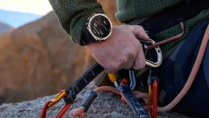 a photo of a man climbing wearing a Amazfit T-Rex Ultra 2