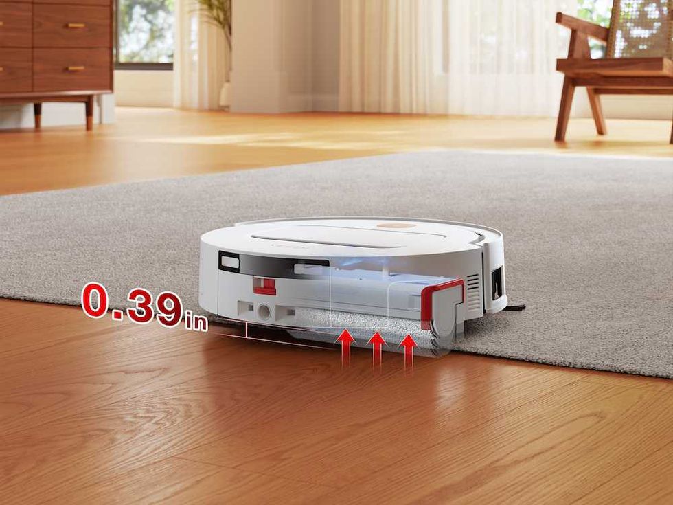 photo of Yeedi M14 Plus cleaning a carpet and then the floor.