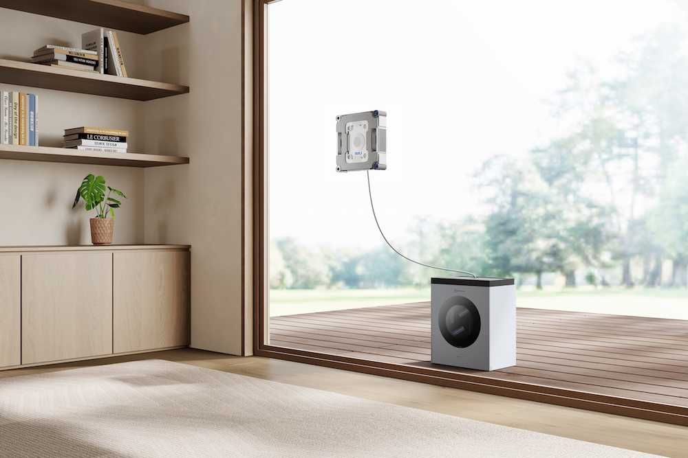 a photo of ECOVACS WINBOT W3 OMNI Robotic Window Cleaner cleaning a window of a house