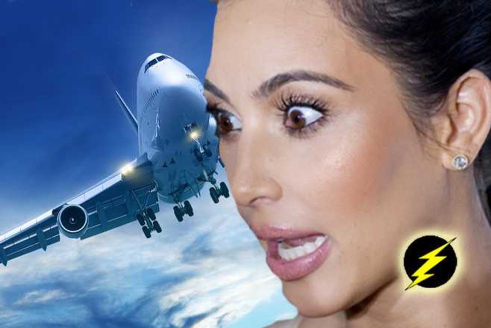 Kim Kardashian Feeds Selfie Obsession With Quickie Airplane Toilet Photo Shoot