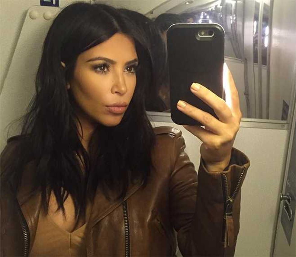 Kim Kardashian Feeds Selfie Obsession With Quickie Airplane Toilet