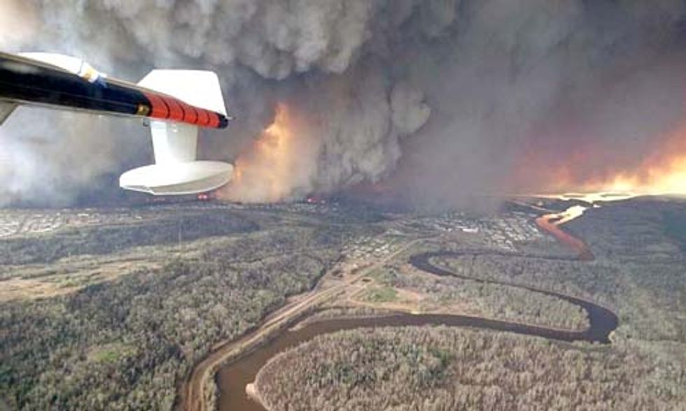Record-Breaking Wildfire Rages On in Canada’s Oil Sands Region
