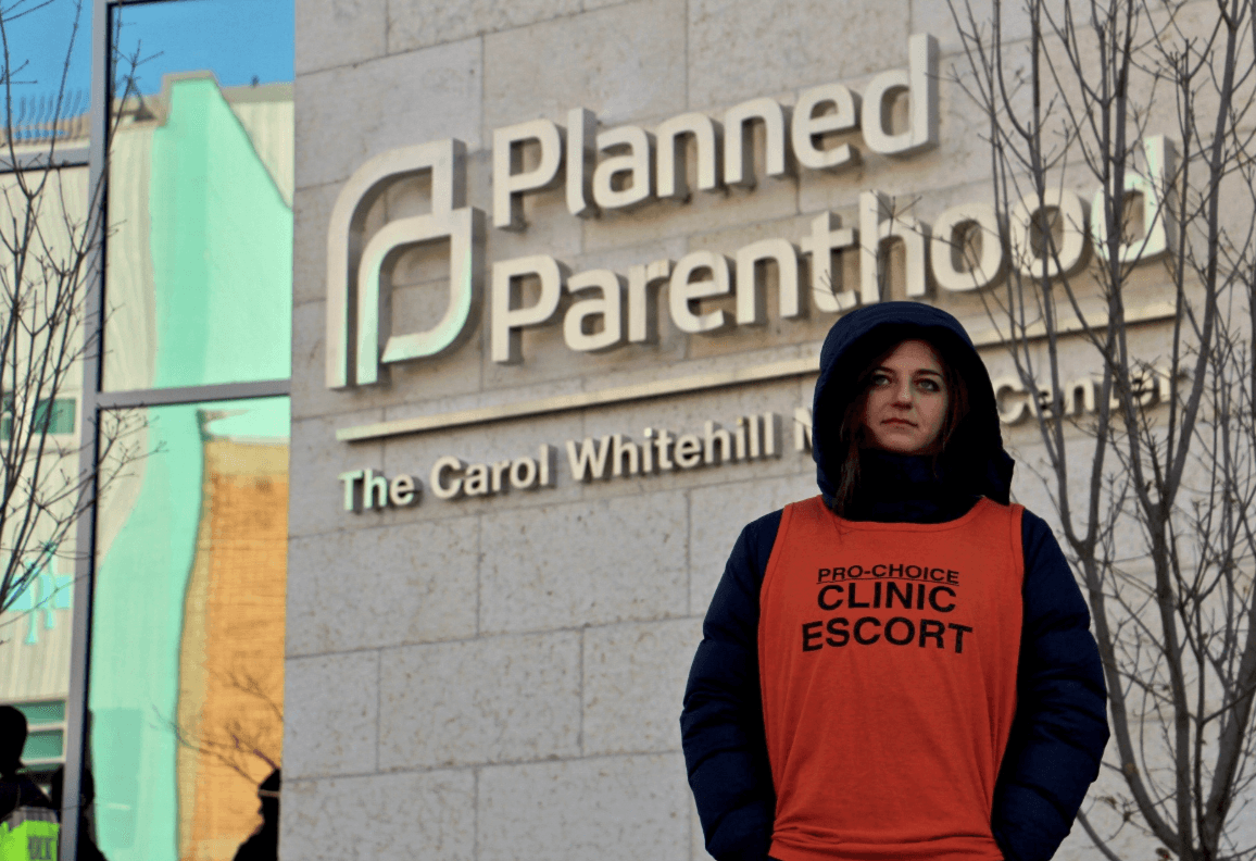 'Harlots And Sluts': Why This Ex-Cop Walks The Gauntlet To Protect Abortion Rights