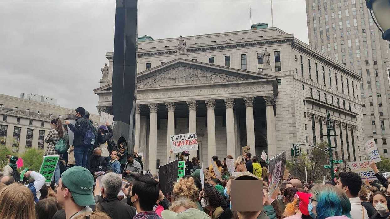 A crowd of abortion rights protesters holding signs in Foley Square in New York City