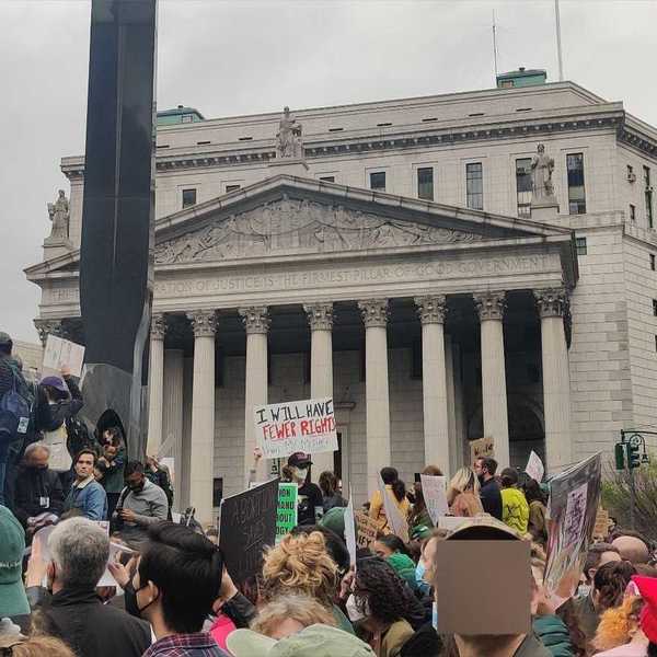 A crowd of abortion rights protesters holding signs in Foley Square in New York City