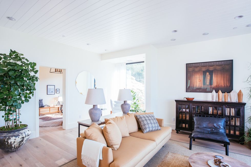 Living room with warm tones, modern details and art work from local artists. 