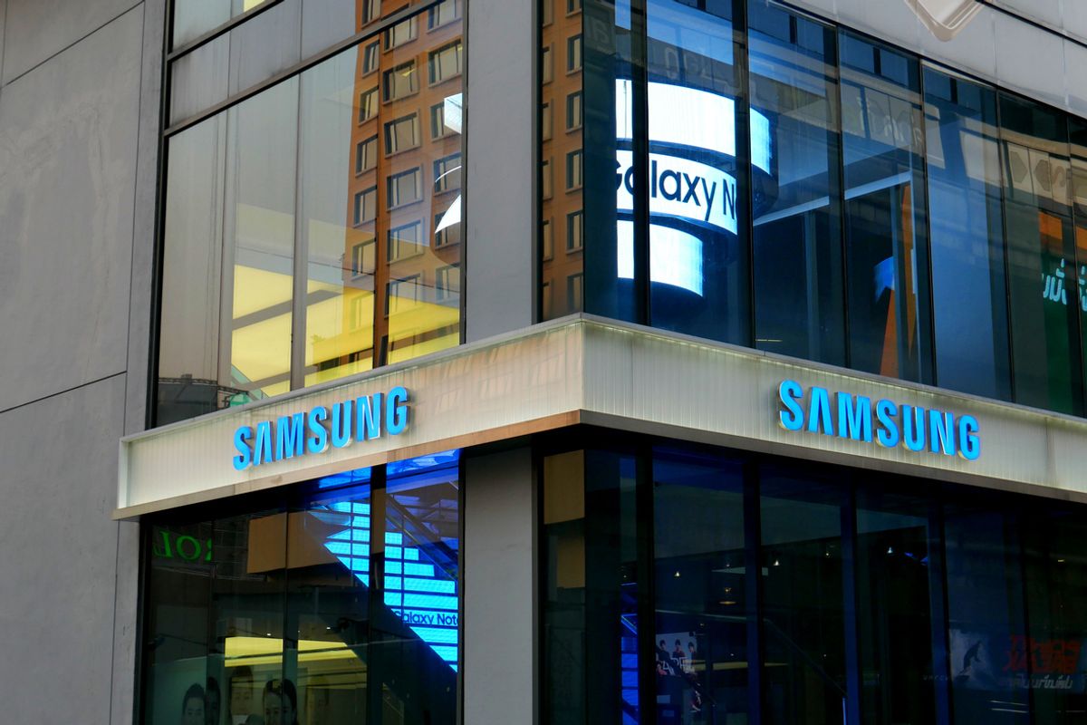 Bangkok, Thailand – December 10, 2015: Exterior view of a Samsung shop in the Siam Square area of Bangkok, Thailand. People walk around the area. The picture is taken from the walkway of sky train station.